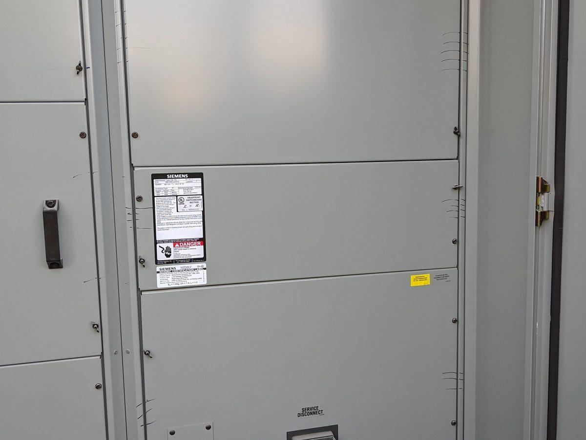 Tall Siemens switchgear in commercial electrical room - AMY Electric