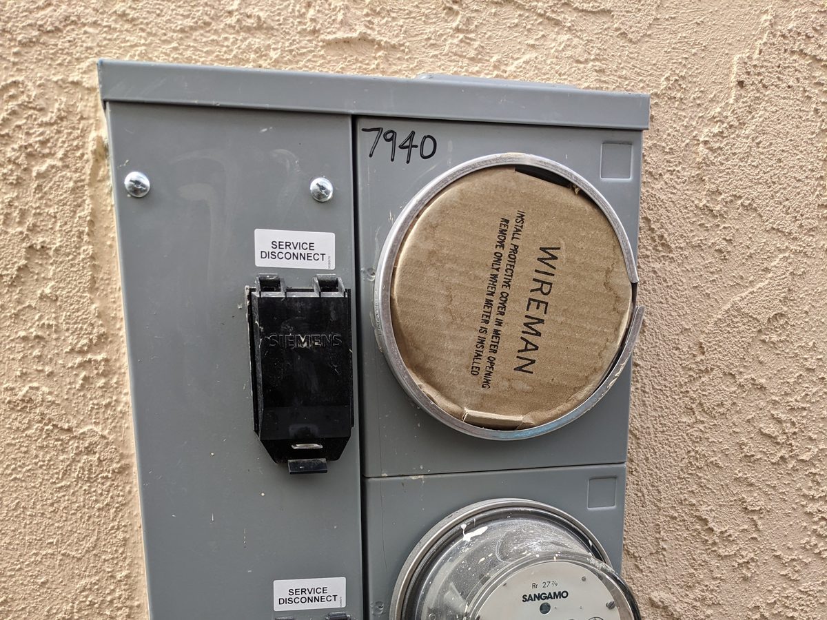 Dual-meter exterior service installation with EV-ready panel