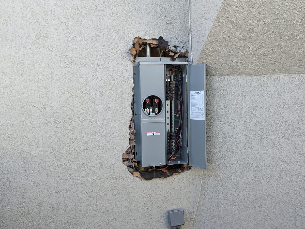 Siemens 200A panel upgrade with exterior stucco finish